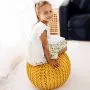 Girl sitting on Yellow Burren Knitted Pod Range