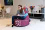 Girl Sitting on the West Ham United F.C. Gaming Bean bag Chair In the Living Room