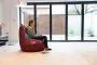 Side Profile of the Girl Sitting on the West Ham United F.C. Gaming Bean bag Chair in the Living Room 