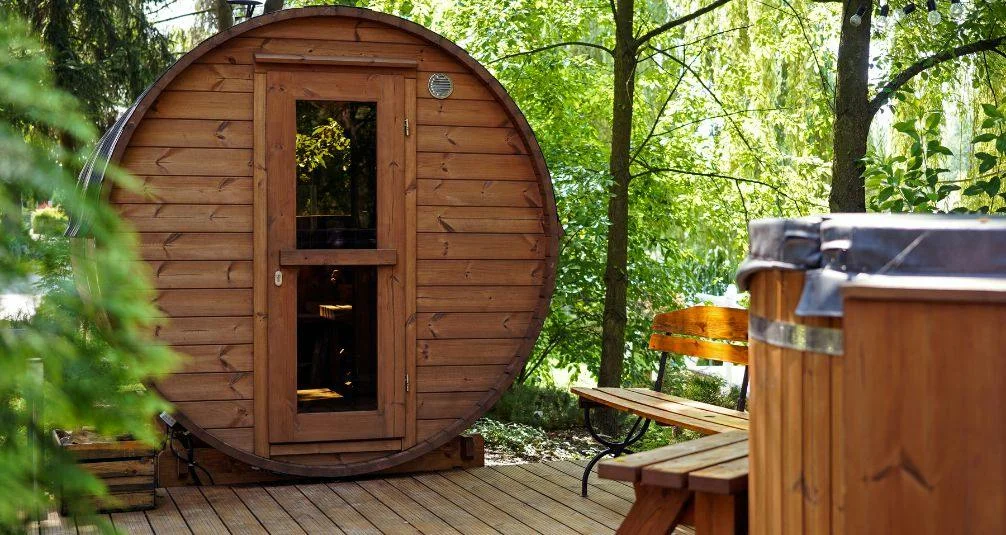 Wooden Barrel Sauna In Garden During Day