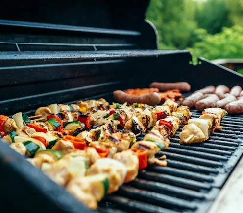 chicken and sausages grilling on a beefeater bbq