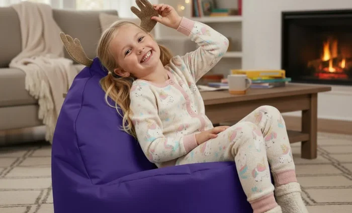 Young child relaxing on a purple bean bag chair