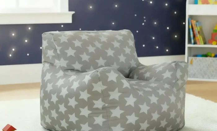 Small grey star-pattern bean bag chair in a children's playroom