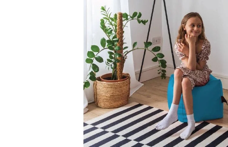Child sitting on Footstool Beanbag