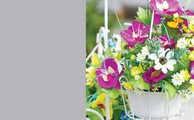 Silk flowers in hanging basket
