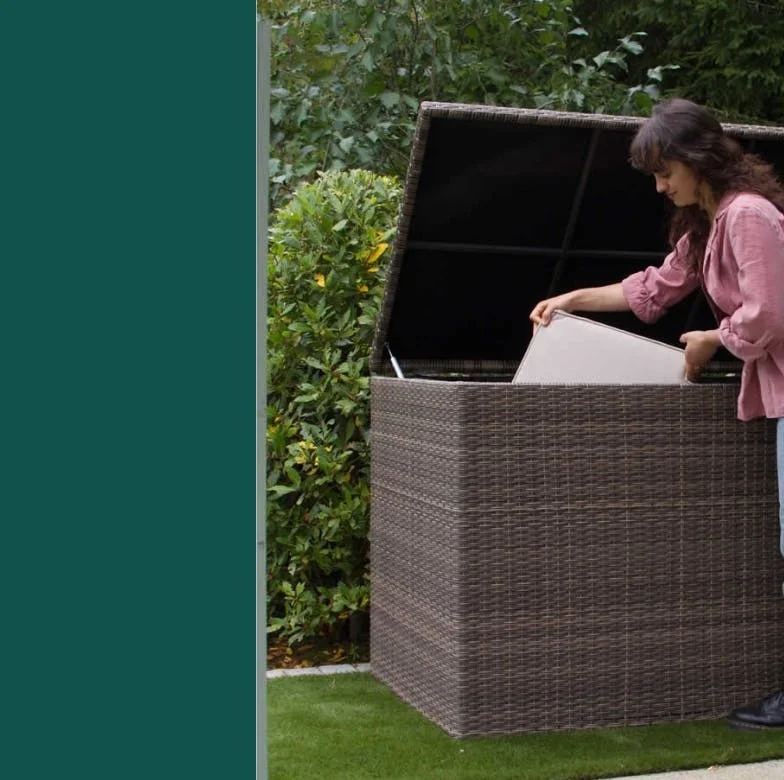 Woman putting cushions into storage box