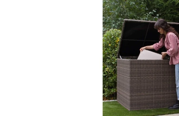 Woman putting cushions into storage box